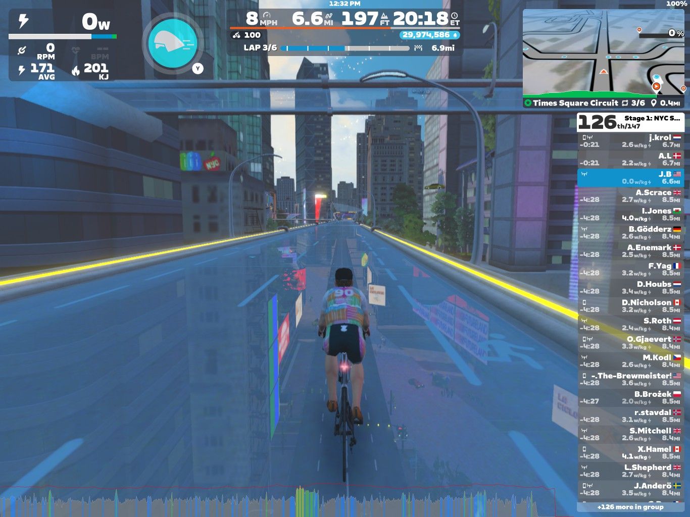 A digital cycling scene in Zwift showing a cyclist on a virtual road lined with tall buildings. The route is illuminated and features a displayed speed of 8 mph, with additional metrics like distance and lap count. A leaderboard on the right lists the names and statistics of other virtual participants.